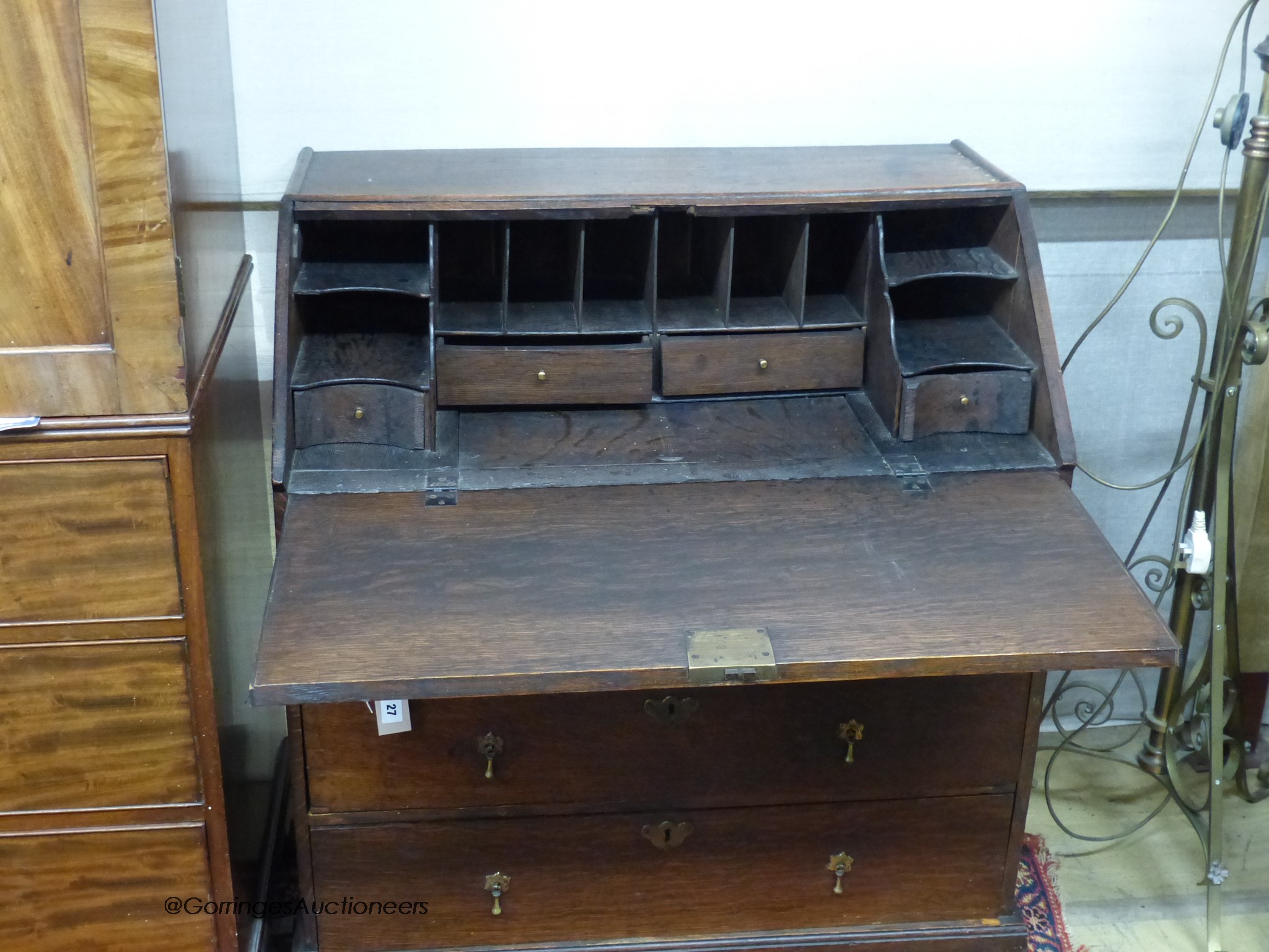 A mid-18th century oak bureau, width 84cm, depth 51cm, height 98cm